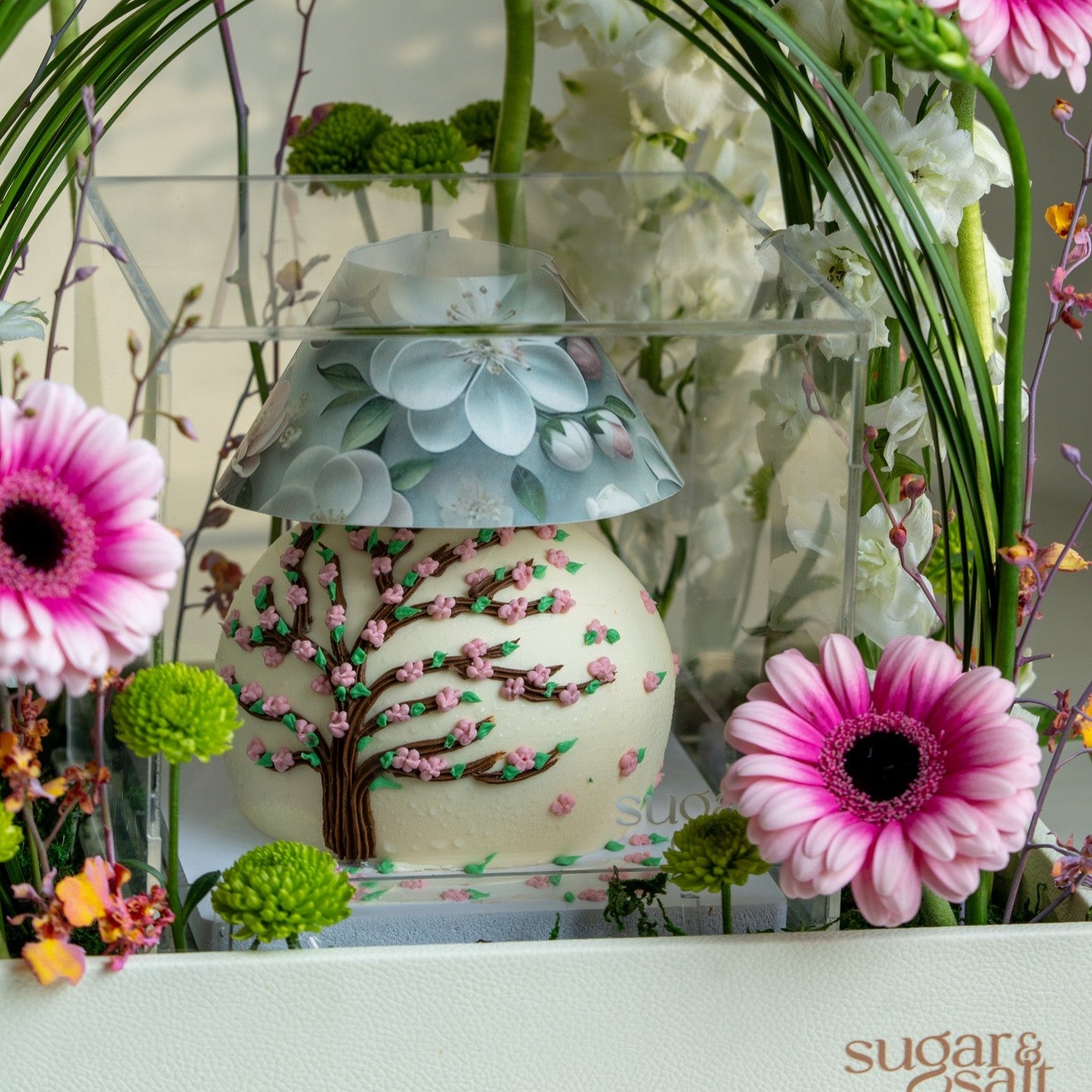 Flower Arrangement With Mini Lamp Cake